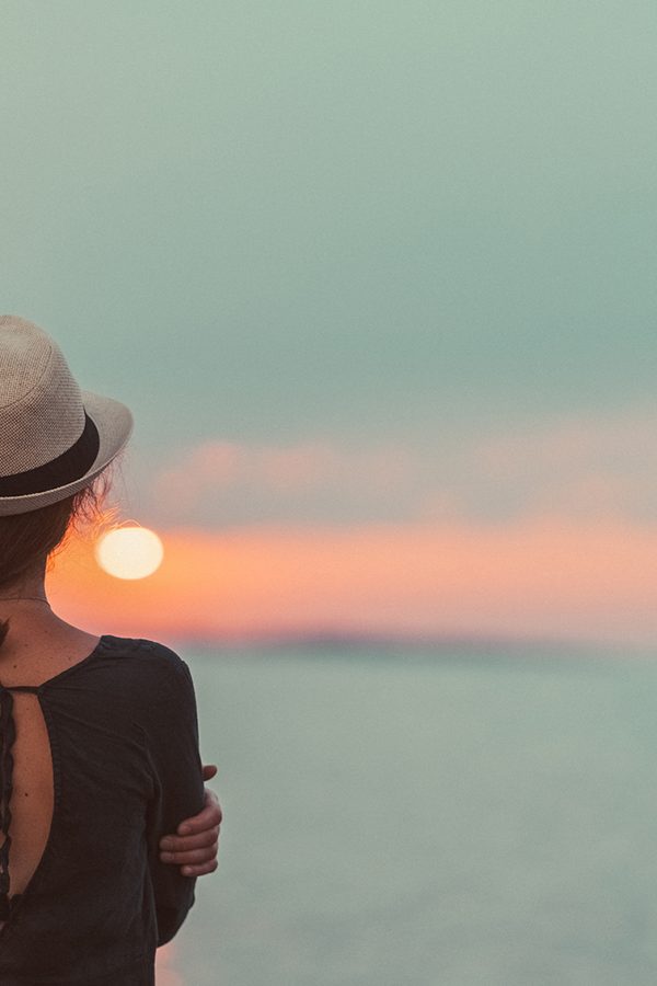 Girl staring at sunset thinking about Convenient Counseling Services