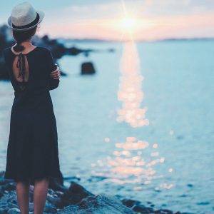 Girl thinking about Counseling services while watching sunset