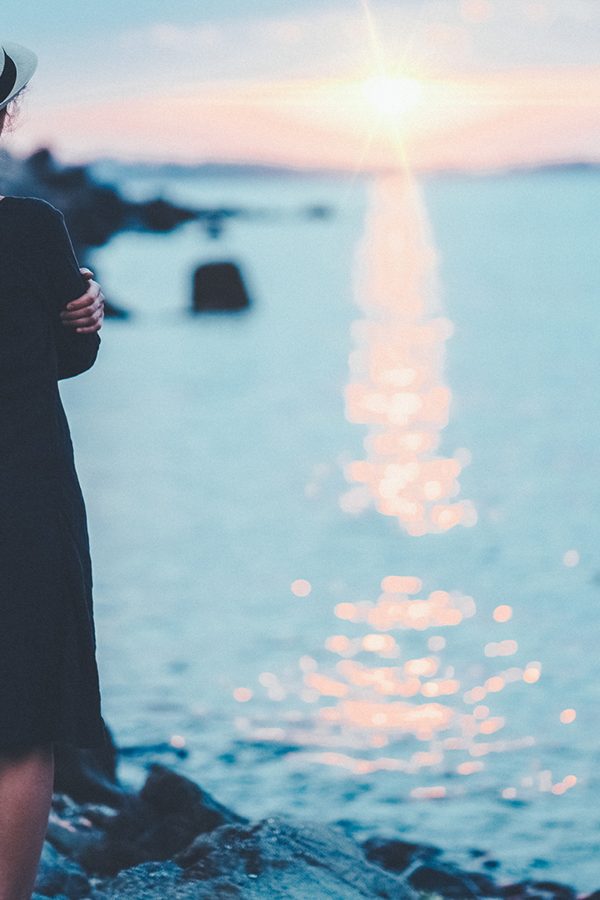 Girl thinking about Counseling services while watching sunset