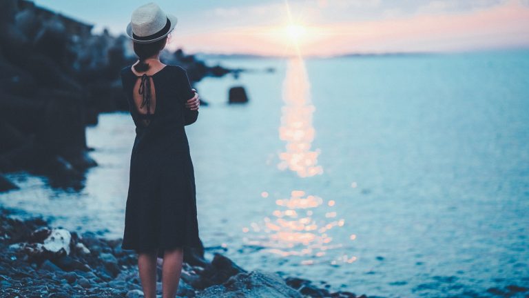 Girl thinking about Counseling services while watching sunset