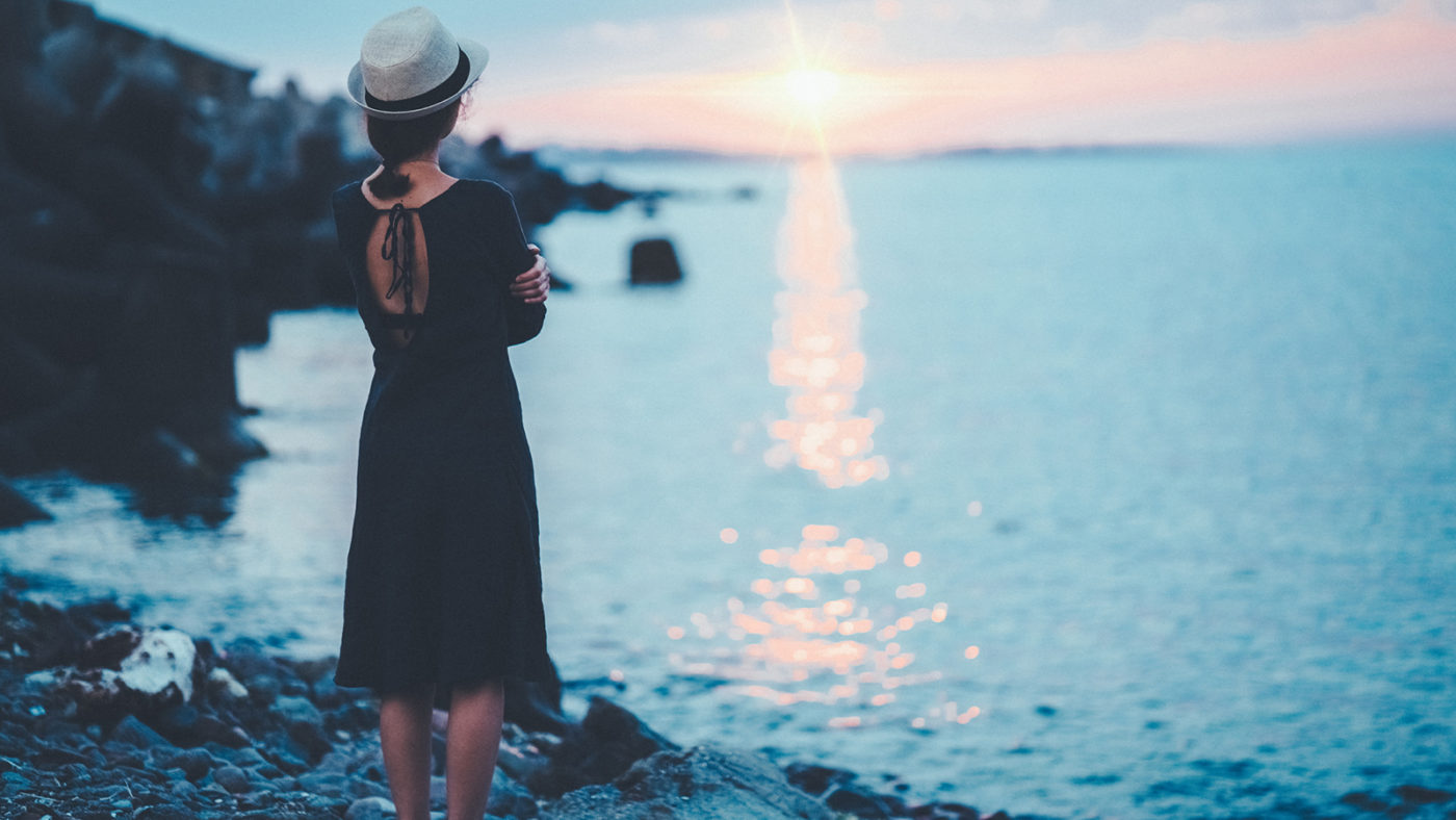 Girl thinking about Counseling services while watching sunset