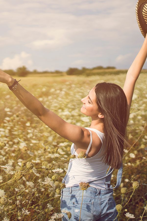 Girl in sunny field in Syracuse, NY