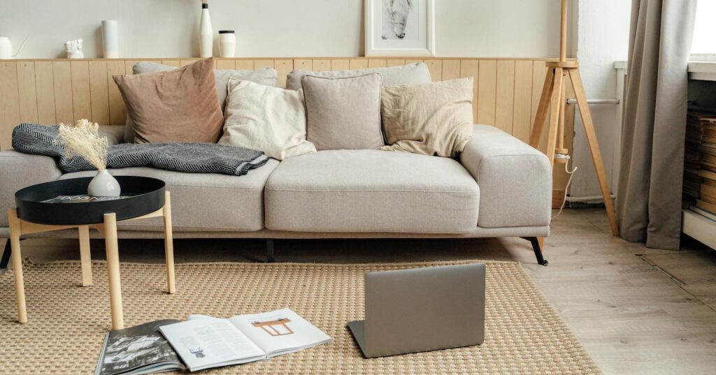 comfortable living room with laptop on floor