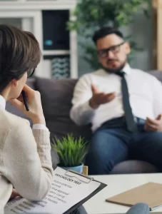 man talking in therapy session