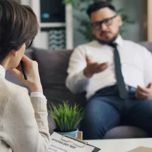 man talking in therapy session