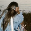 film photograph of woman looking out at lake