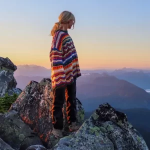 woman on mountain top at sunrise