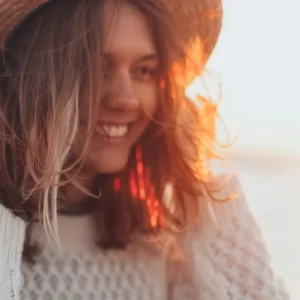 woman in hat smiling
