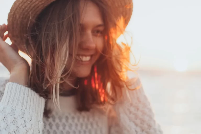 woman in hat smiling