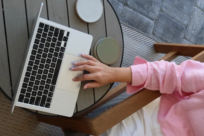person typing on laptop