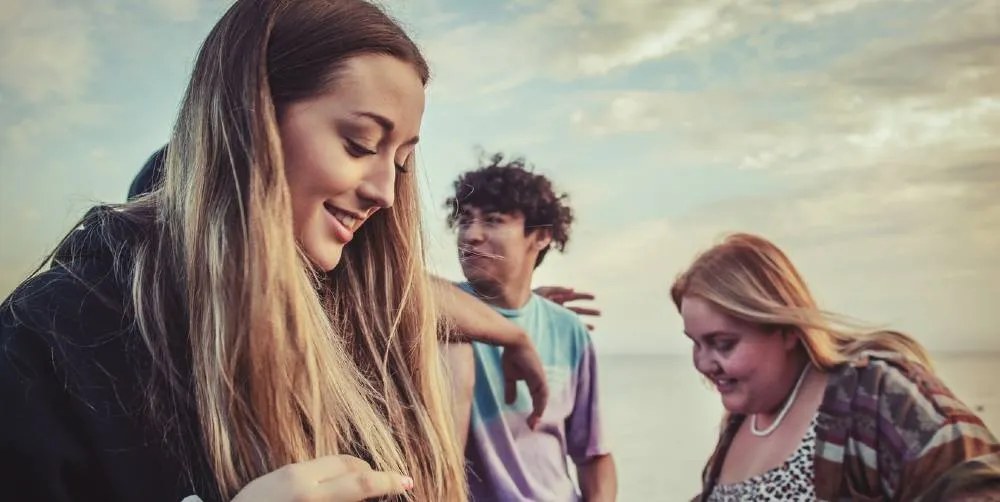 three teens outdoors