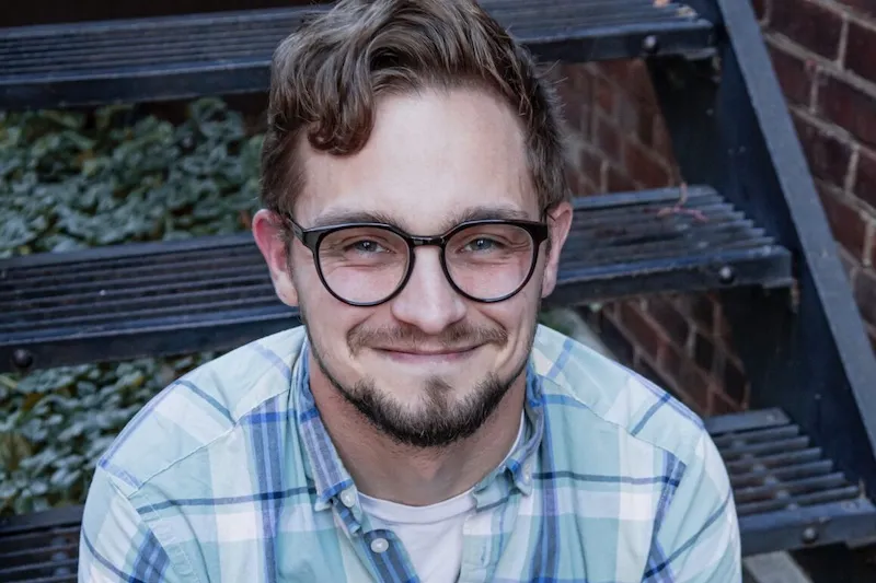 cody bowser smiling warmly at the camera
