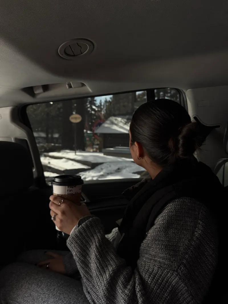 woman in back seat of car alone