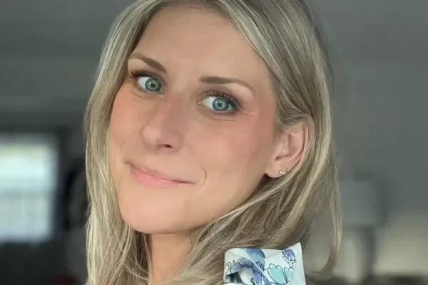 convenient counseling services woman with blonde hair smiling over shoulder at camera